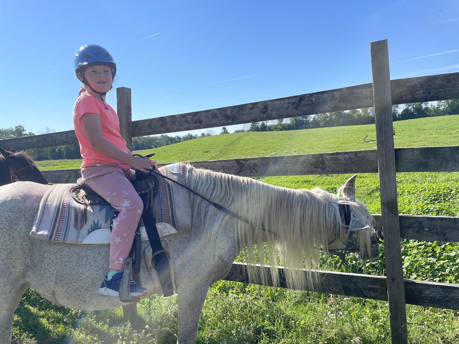 Evelyn riding outdoors at LaFleur Stables